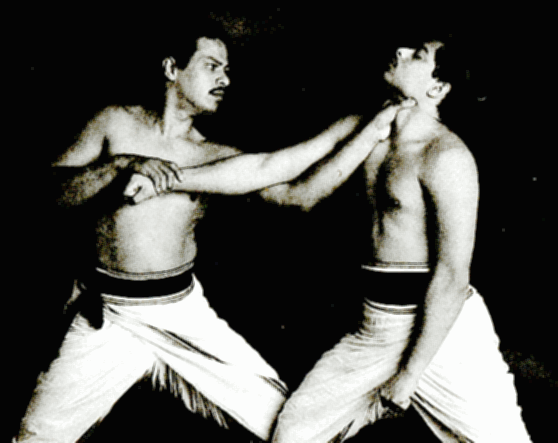 Two personfighting and practicing Varma Kalai