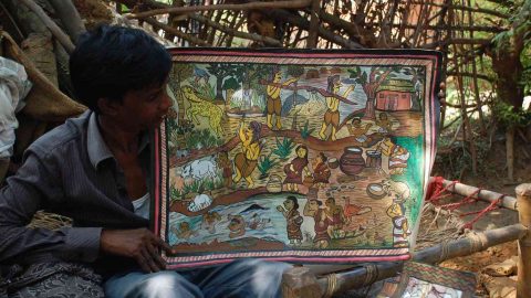 A chitrakar showing paitkar painting