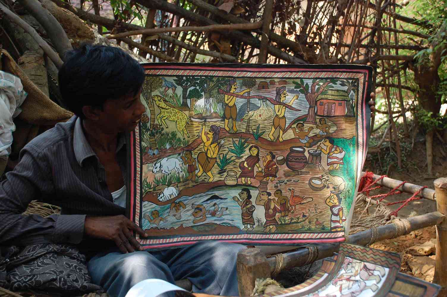 A chitrakar showing paitkar painting