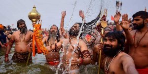 Naga Sadhus bathing during Kumbh Mela