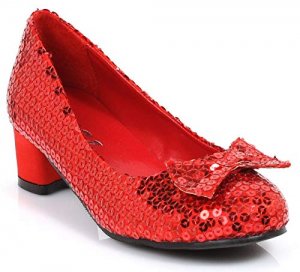 A red shoe with a bow having sequin decorations