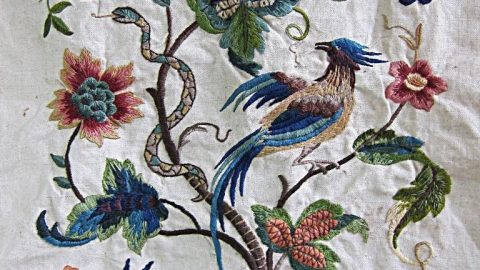Beautiful embroidery depicting tree and birds and snakes